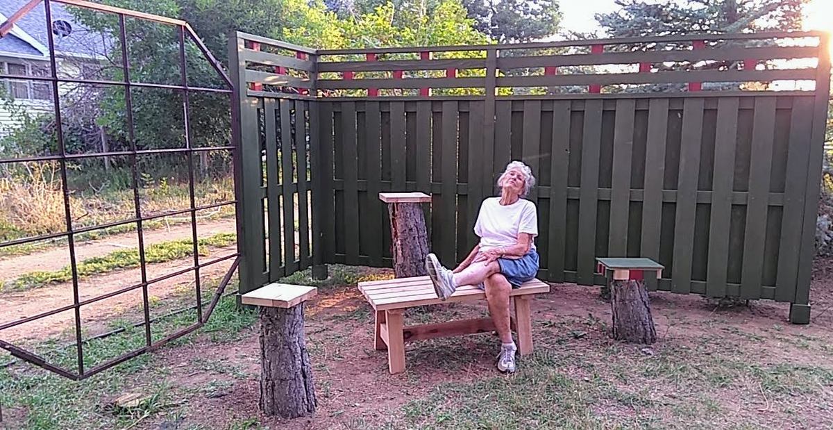 Dell loves her new fence & bench, from leftover lumber