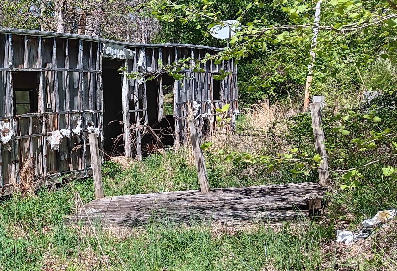 A derelict trailer on the land, waiting to be cleared